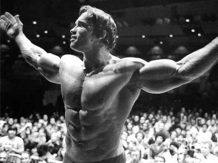Arnold Schwarzenegger demonstrating at a bodybuilding exhibition