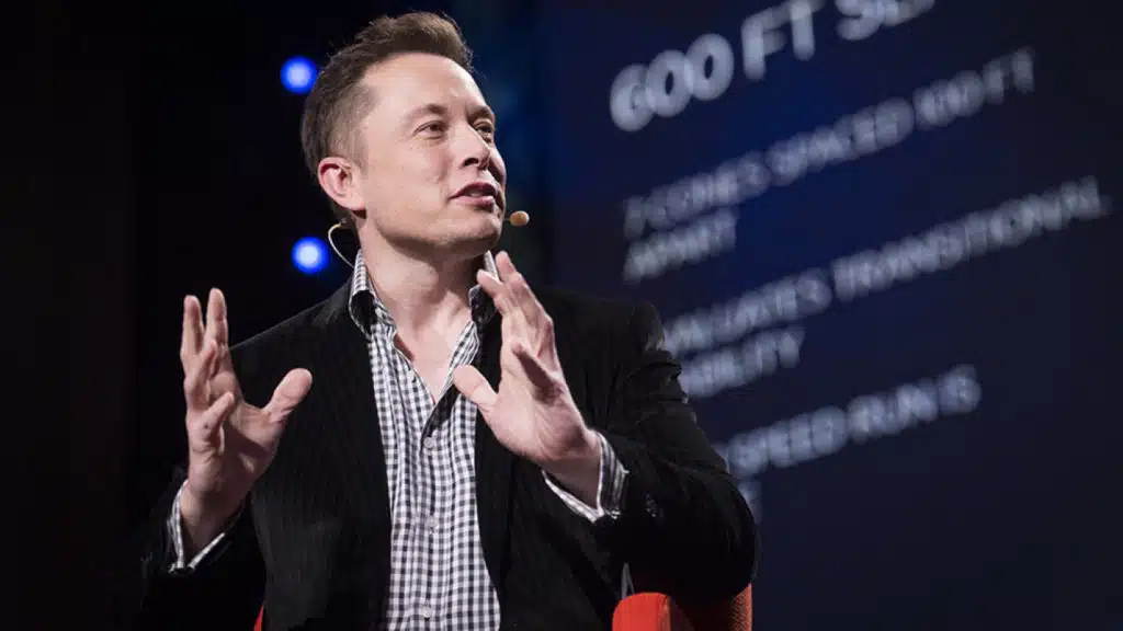 Elon Musk speaking at a conference